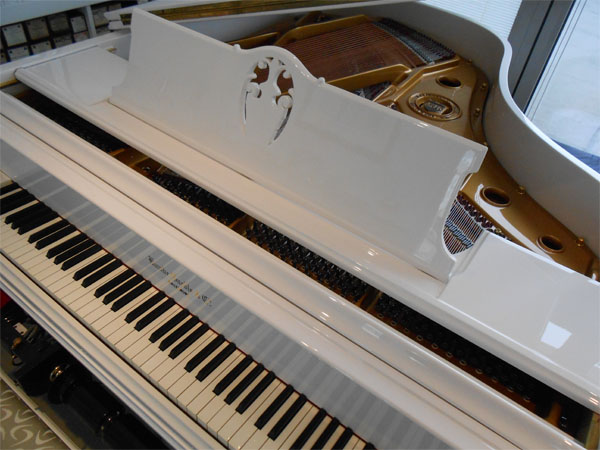 White piano with keys